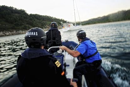 Customs officials prepare to board a craft in the Vigo estuary, Galicia.