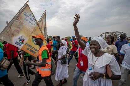A group of the Catholic faithful from the town of Rumbek cheer as they arrive after walking for more than a week to reach the capital for the visit of Pope Francis, in Juba, South Sudan Thursday, Feb. 2, 2023. 