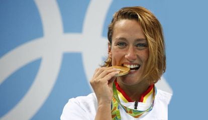 Swimmer Mireia Belmonte with her Olympic gold medal for the 200m butterfly.