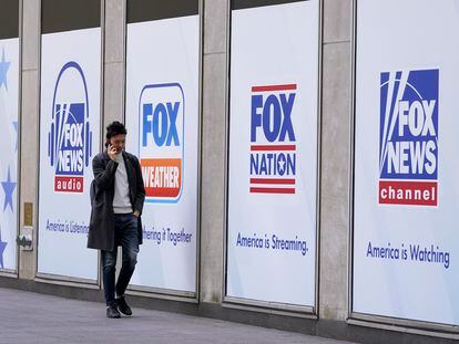 A man walks past the News Corp. and Fox News headquarters on April 19, 2023, in New York.