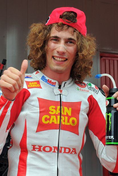 Marco Simoncelli enjoying one of his victories.