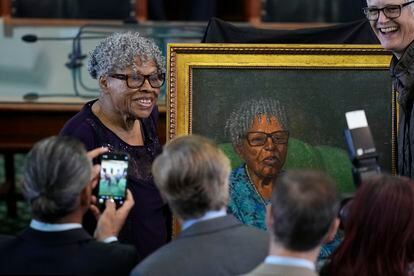 Opal Lee, left, who helped make Juneteenth a federally recognized holiday, poses with her portrait after it was unveiled in the Texas Senate Chamber, Wednesday, Feb. 8, 2023, in Austin, Texas.