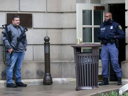 A policeman stands guard at the entrance to the state capitol during a gun rights rally, in Lansing, Michigan, in 2021.