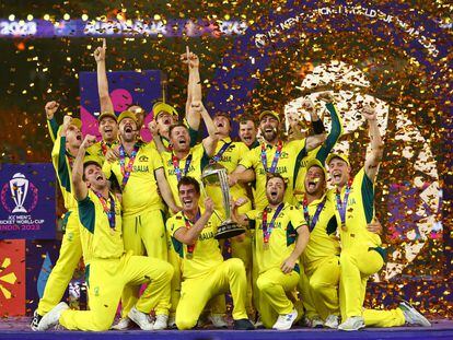Australian players celebrate with the trophy after winning the ICC Cricket World Cup, on November 19, 2023.