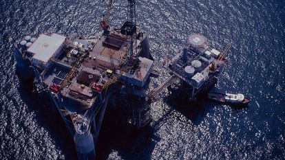 Offshore drilling rig next to a production platform in the Gulf of Mexico.