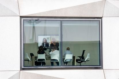 Office workers in London attend a Zoom meeting on September 21, 2021.