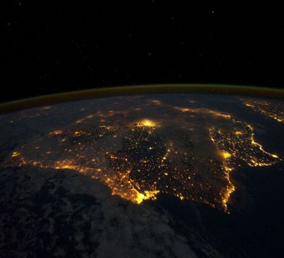 An image taken by the international space station of Spain at night. Madrid is seen in the middle glowing furiously. 