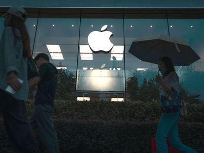 People walk past an Apple Store in Shanghai, China, a day after the company unveiled the iPhone 15 on September 13, 2023.