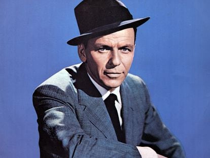Frank Sinatra, ‘The Voice,’ posing in his signature suit and hat.