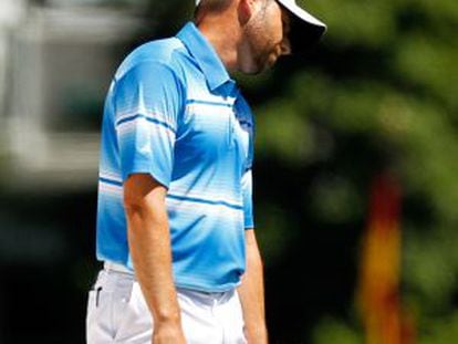 Sergio Garc&iacute;a reacts after a shot on the first hole during the third round of the 2012 Masters. 