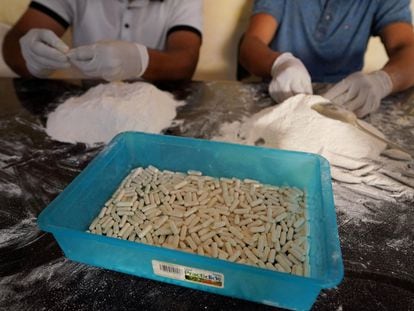 Members of the Sinaloa Cartel prepare capsules with methamphetamine in a safe house in Culiacan, Mexico, April 4, 2022.