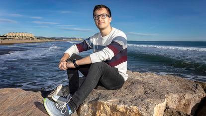Jesús Lucero, a 26-year-old engineer who suffers from eco-anxiety, on Patacona beach in Valencia.