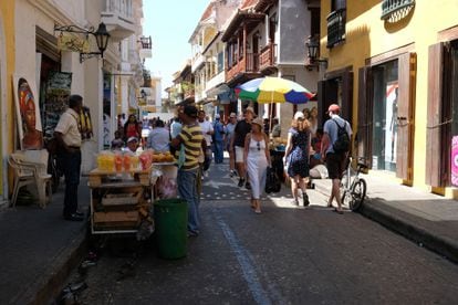 Tourists stroll the streets of Cartagena, Colombia.