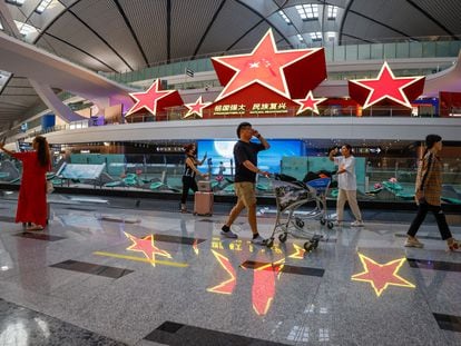 Travelers at Beijing-Daxing International Airport on August 31.