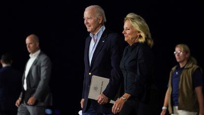 U.S. President Joe Biden and first lady Jill Biden walk from Air Force One upon their arrival in Reno, Nevada, U.S., August 18, 2023.