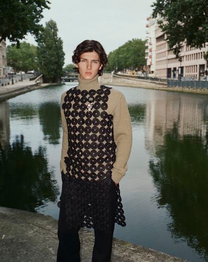 “I’d like to keep working with fashion as long as I can,” says the model, who turned 24 this summer. In the photograph, he is wearing a knitted sweater by Loro Piana, and shirt and pants by Wales Bonner. 