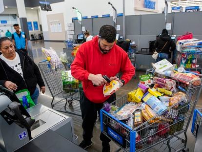 A man buys groceries at the Walmart Supercenter in North Bergen, New Jersey, on February 9, 2023.