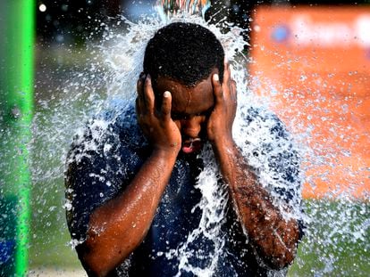 With temperatures setting a new record of 108 degrees in Abilene, Texas on June 20, 2023, a local stood beneath one of the water spouts at the Nelson Park Splash Pad to cool off.