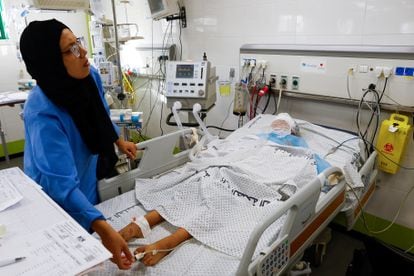 A health worker attends to a Palestinian teenager admitted to the Intensive Care Unit of the Nasser hospital in Gaza on Thursday. Doctors at the hospital have complained that they can only treat critical cases due to fuel shortages.