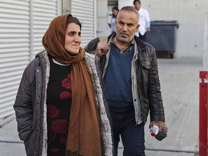 Two of the Kurdish refugees leave a Barcelona hospital.