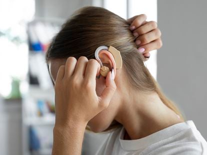 A young woman with a hearing implant.