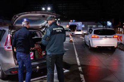 The Civil Guard check a car at the border with Spain.
