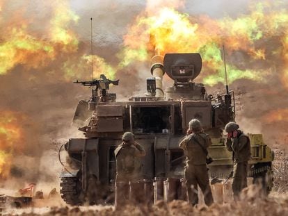 An Israeli army self-propelled howitzer fires rounds near the Gaza border in southern Israel on October 11, 2023.