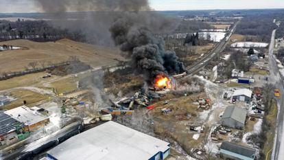 A plume of smoke rises from a Norfolk Southern train that derailed Feb. 3 in East Palestine, Ohio are still on fire at mid-day, Feb. 4, 2023.