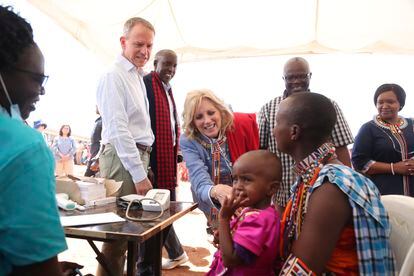 US first Lady Jill Biden, center, greets women of the Maasai community as they explain the drought situation in Ngatataek, Kajiado Central, Kenya, Sunday, Feb. 26, 2023. Biden is in Kenya on the second and final stop of her trip. (AP Photo/Brian Inganga)