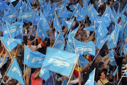 PP supporters celebrate outside the party's Madrid headquarters on Sunday night.