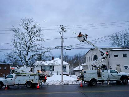 Central Maine Power Co. lineman John Baril works to restore electricity, on March 15, 2023, in Lewiston, Maine.