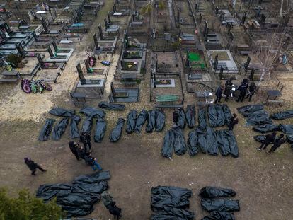 Police officers in Bucha on Wednesday worked to identify the bodies of civilians killed in this Ukrainian city.