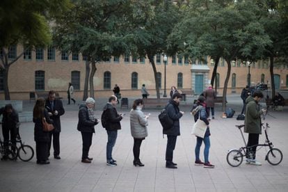 Barcelona voters wait in line to cast their vote in the Catalan election.