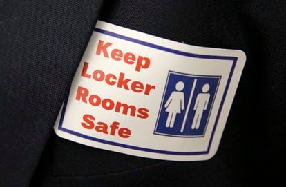 A sticker that reads, "Keep Locker Rooms Safe," is worn by a person supporting a bill that would eliminate Washington's rule allowing transgender people use gender-segregated bathrooms and locker rooms in public buildings consistent with their gender identity, on Jan. 27, 2016, at the Capitol in Olympia, Wash.