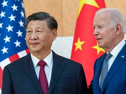 US President Joe Biden, right, stands with Chinese President Xi Jinping before a meeting on the sidelines of the G20 summit meeting in November 2022, in Bali, Indonesia.