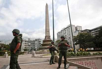 Members of the Venezuelan National Guard watch over Caracas's Plaza Altamira.