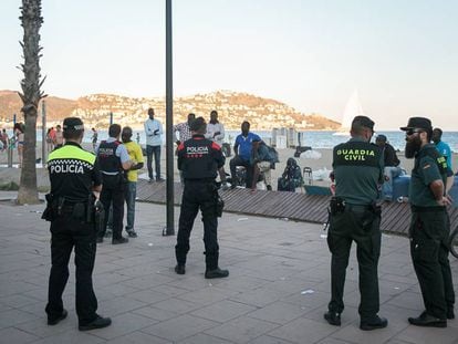 Local police officers and Civil Guards in the Catalan resort town of Roses.