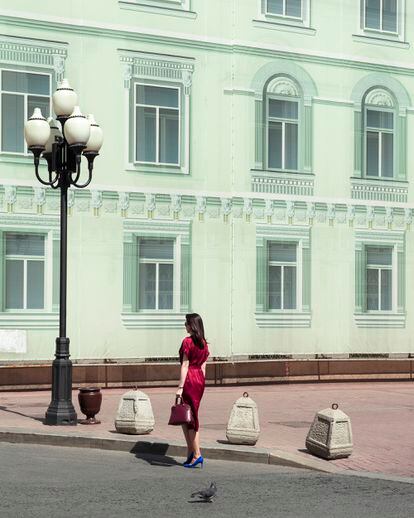 A woman on Moscow's Arbat street, a commercial throroughfare, in 2021.