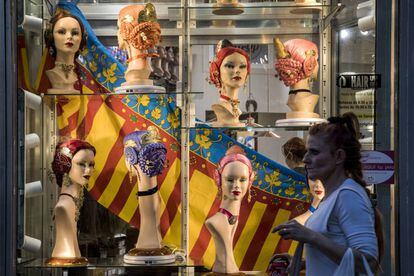 The city is transformed during the festival. In the image, a wig shop in central Valencia.