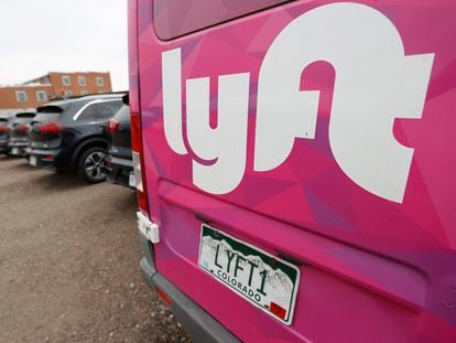 A Lyft ride-hailing vehicle is parked near Empower Field at Mile High in Denver on April 30, 2020