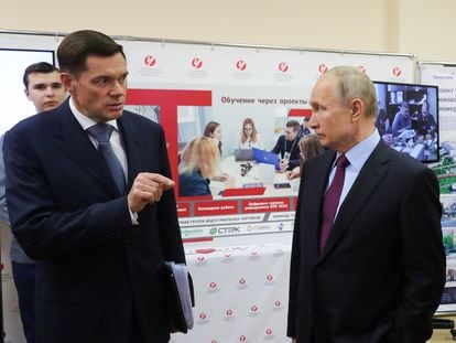 (l) Russian oligarch Alexei Mordashov with Russian President Vladimir Putin.
