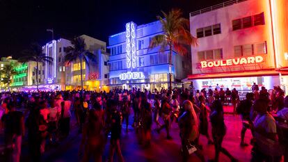 Crowds walk up and down Ocean Drive during spring break on on March 18, 2023, in Miami Beach, Florida.