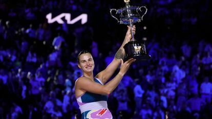 Aryna Sabalenka of Belarus holds the Daphne Akhurst Memorial Trophy aloft after defeating Elena Rybakina of Kazakhstan in the women's singles final at the Australian Open tennis championship in Melbourne, Australia, Saturday, Jan. 28, 2023