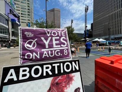 A sign asking Ohioans to vote in support of Issue 1 sits above another sign advocating against abortion rights at an event hosted by Created Equal on Thursday, July 20, 2023, in Cincinnati, Ohio.