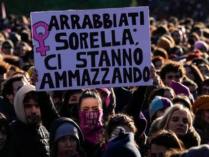 A woman holds a poster with the phrase “Get angry, sister, they’re killing us,” at a march protesting violence against women in Rome, this past Saturday, November 25, 2023.