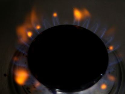 A lit burner on a gas stove.