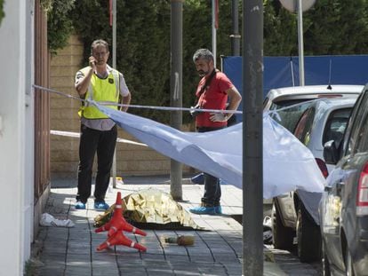 Catalan police officers at the scene of a murder.