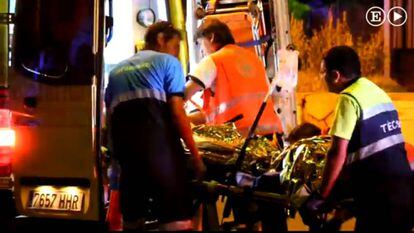 The victim's body is taken away on Wednesday night.