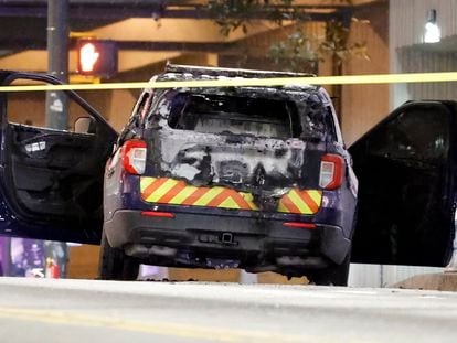 A burned police car sits on the street following a violent protest, Saturday, Jan. 21, 2023, in Atlanta, in the wake of the death of an environmental activist killed after authorities said the 26-year-old shot a state trooper.