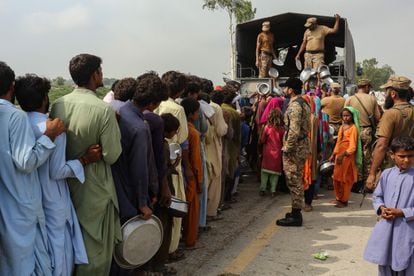 The Pakistan Army distributes food to people affected by flooding in Punjab province; August 27, 2022.